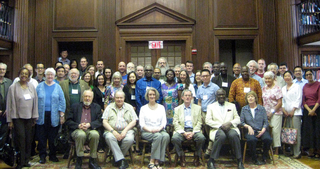 A group of people in a library.
